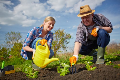 Professional landscapers reviewing a service booking